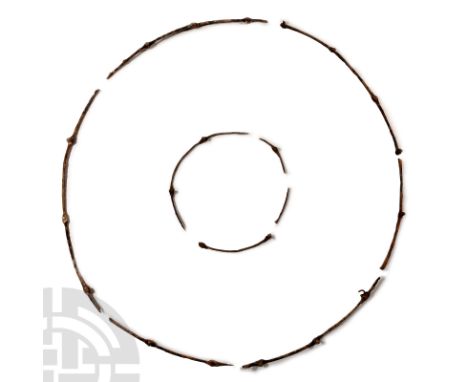 12th-13th century A.D.. Square in section and curved in profile with pierced lobes and attachment rivets. Cf. in Dmitriev, A.