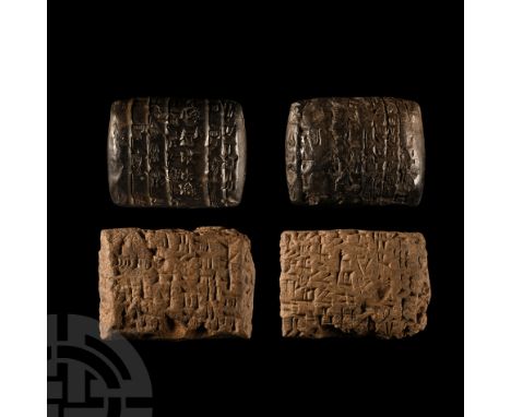 Late 3rd-early 2nd millennium B.C. Comprising two pillow-shaped clay tablets comprising: one in dark brown material, cuneifor