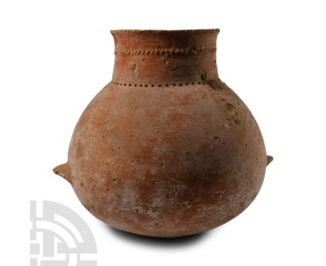 Early Bronze Age, 3rd millennium B.C. Biconvex globular body with broad neck, everted rim, two ledge handles below the equato