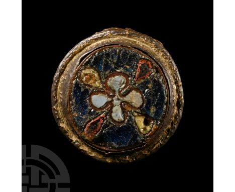 Circa 11th century A.D.. With central raised cell and cloisonné enamel quatrefoil, flange rim. Cf. Hattatt, R., Brooches of A