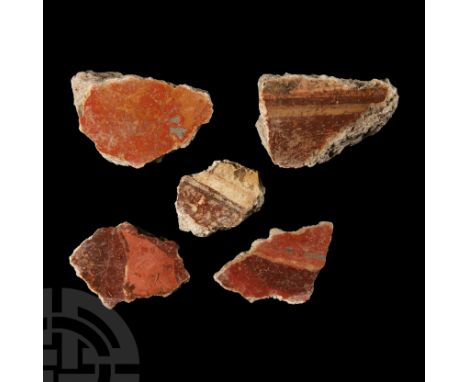 1st century A.D.. Comprising five pieces in cream, orange, blue and red with painted architectural lines; one with floral dec