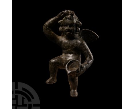 1st-2nd century A.D.. Modelled with the right hand in a fist placed on the brow, left hand supporting a cup on the knee, wing