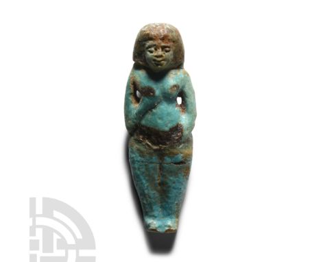 Late Period, 664-332 B.C. Wearing a short wig, with right hand to breast holding a sash that hangs over the shoulder and left