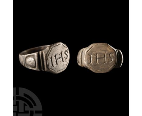 18th-19th century A.D.. Ribbed shoulders with facing masks, octagonal bezel with ornate 'IHS' legend. Cf. Chadour, A.B., Ring