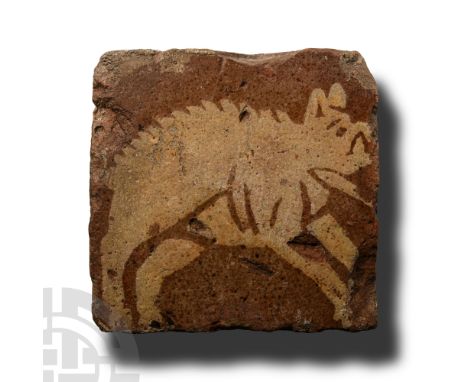 Northern France, circa 1300 A.D.. Glazed square floor tile with cream-coloured image of a hog running with legs extended. Cf.