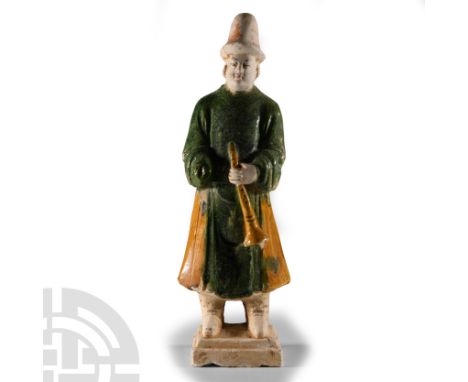 Ming Dynasty, 1368-1644 A.D. or later. Modelled standing with the right hand inside the sleeve, left hand held to the chest h