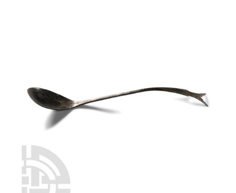 Circa 1st-3rd century A.D.. With shallow lenticular bowl, swept handle, swallow-tail finial with notched edges. Cf. Riha, E. 