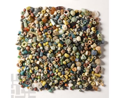 1st millennium B.C. and later. Comprising a quantity of mixed beads, mainly oblate and cylindrical in form, including glass, 