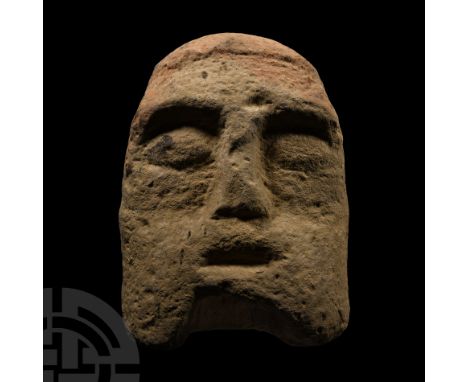 2nd century B.C.-1st century A.D.. Irregular D-shaped head with reserved 'cap', almond-shaped eyes and slit mouth; pierced ve
