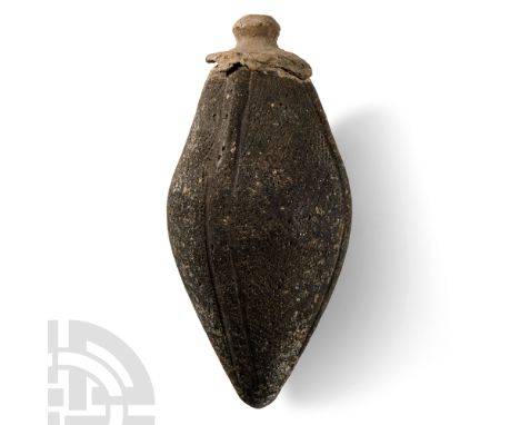 9th-11th century A.D.. Biconical body with longitudinal ribs, separate lead-alloy domed filler-hole with cover, intended to b