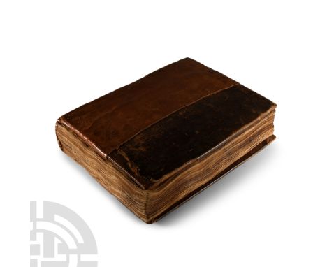 17th century A.D.. Wooden end-boards covered with tooled leather, later reinforced with a new plain leather spine and replace