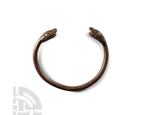 6th-4th century B.C. Penannular in form, each terminal formed as a serpent's head with scale detailing.  24 grams, 60 mm (2 3