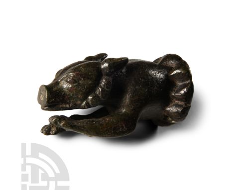 2nd-4th century A.D.. Hollow-formed fitting of a leaping hound with forelegs extended; segmented base with two fixing holes. 