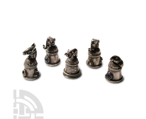 20th century A.D.. Group of five silver-coloured metal thimbles, each with a domed top surmounted by an animal's head (elepha
