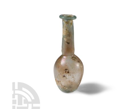 1st-2nd century A.D.. Having piriform-globular body and everted rim, tubular neck and flat base with small kick. See Whitehou