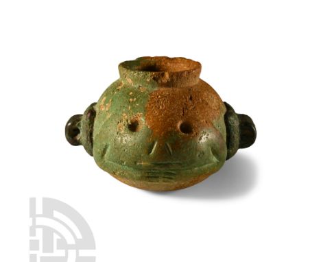 Predynastic Period, Late Naqada I-Naqada II, circa 3700-3300 B.C. Squat ovoid in profile, modelled with the legs folded benea