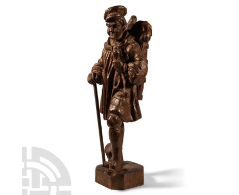 Circa 19th century A.D.. Dressed in a peaked cap, smock, ankle-length trousers and clogs, standing holding a churchwarden smo
