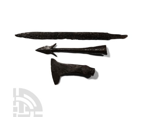 Circa 6th-7th century A.D.. Comprising: axehead with sturdy square-section neck, T-shaped blade, hammer-face to rear of the s