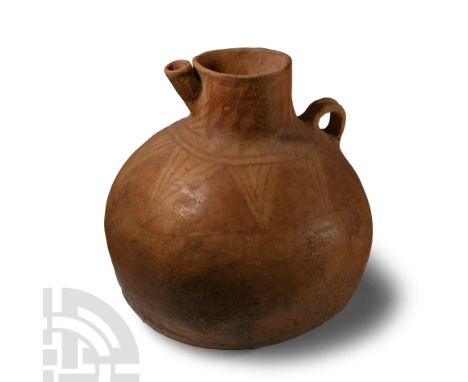 Neolithic Period, 4th-2nd millennium B.C. Globular body with tubular neck, angled spout and small loop handle to the shoulder