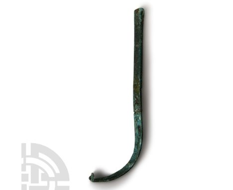 1st-2nd century A.D.. With C-section scraper and handle with semi-circular profile, the handle engraved with a stylised fruit
