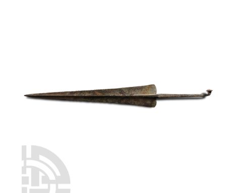1900-1650 B.C. Each side rising to a pointed ridge, curved tang for attaching to a shaft. Cf. Comstock, M., Vermeule Corneliu