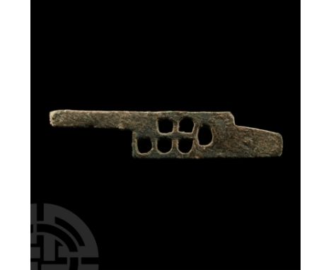 1st-2nd century A.D.. Locking plate with six circular and D-shaped piercings to accept the bits of a key.  14.4 grams, 67 mm 