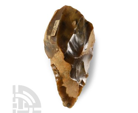 Lower Palaeolithic Period, circa 400,000-200,000 B.P.. Triangular with broad rounded butt; with old inked inked label 'Callan