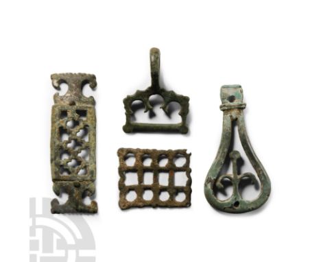 2nd-6th century A.D.. Comprising: a rectangular plaque with stepped void openwork and scrolled ends; a rectangular mount with