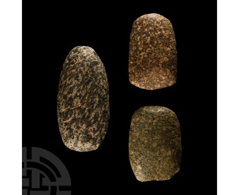 Neolithic Period, circa 6th-4th millennium B.C. Group of three axeheads each with a thick, rounded butt; two with narrow work