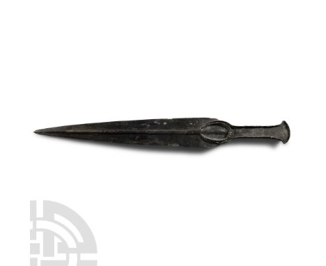 Circa 1000 B.C. Composed of a leaf-shaped blade with a raised penannular rib and slot below the shoulder connected to the gri