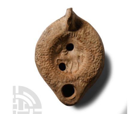 Circa 2nd century A.D.. Comprising a ring handle, filling-hole and air hole in lower discus; the discus with a horse advancin