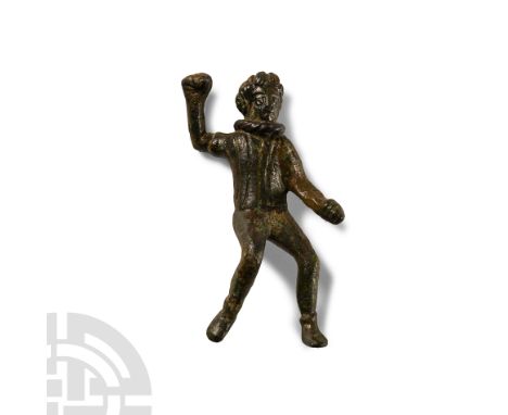 Circa 1st-2nd century A.D.. Modelled in the round, standing with right leg bent, right arm raised and left extended before th