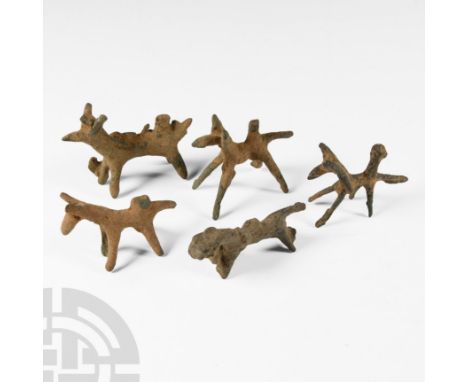 13th-7th century B.C. Model horses each with splayed legs and a stub to the rump (to accept a rider figure?).  65 grams total