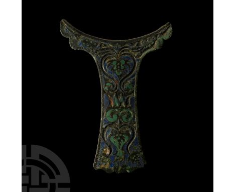 1st-2nd century A.D.. Flat in section with crescentic upper end and scrolled lower end, the surface formed with symmetrically