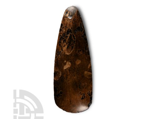 Neolithic Period, circa 6th-4th millennium B.C. With gently curved cutting edge, shallow pointed butt. Cf. MacGregor, A., (ed