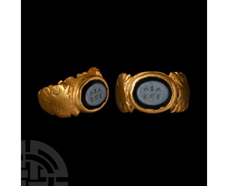 Mid 3rd century A.D.. With balustered hoop, broad shoulders with scrolled foliage detailing, discoid bezel with cell, inset n