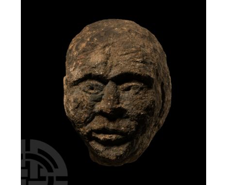 2nd century B.C.-1st century A.D.. Carved in the round as a male head with triangular chin and jaw, broad square brow, lentoi