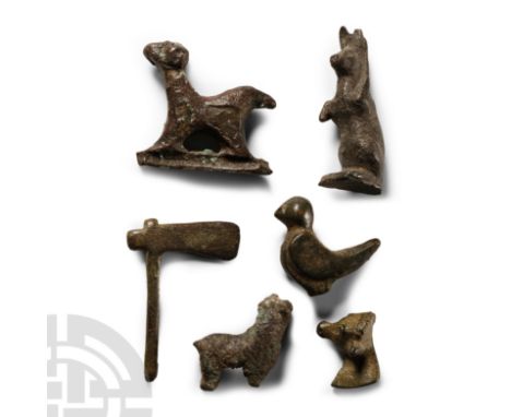 Mainly 1st-2nd century A.D.. Mixed group of votives including a hare, bull, axe and other items.  48 grams total, 15-33 mm (5