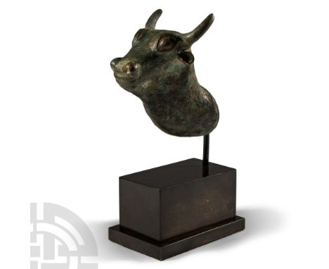 Early 1st millennium B.C. Hollow-formed head of a bull with short curved horns, large bulbous eyes, lateral scooped ears, sho