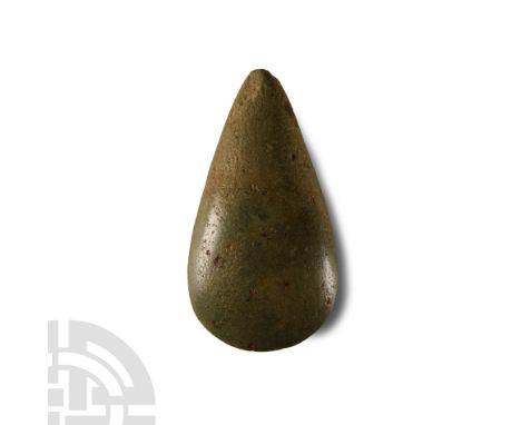 Neolithic Period, circa 4th-3rd millennium B.C. Teardrop-shaped with pointed butt and crescent cutting edge.  122 grams, 86 m