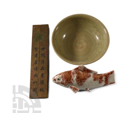 20th century A.D. and earlier. Mixed group comprising: celadon ware bowl (repaired), glazed ceramic model carp; two rectangul