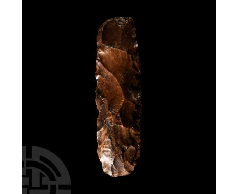 Mesolithic Period, circa 15th-10th millennium B.C. Roughly rectangular core axe with rounded edge and small patch of cortex t