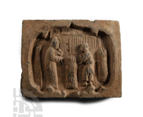 Song Dynasty, circa 960-1279 A.D.. Rectangular wall tile with recess, two figures in a domestic setting.  1.49 kg, 24 cm (9 1