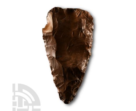 Lower Palaeolithic Period, circa 200,000 B.P.. Lentoid in section with broad cutting edge and narrow point. Cf. MacGregor, A.