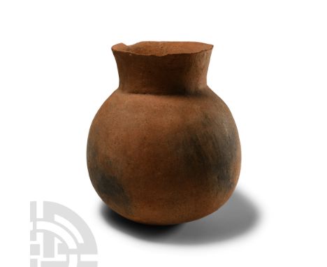 Early Bronze Age, 3rd millennium B.C. With globular body and broad flared mouth; cracked.  415 grams, 15 cm high (5 7/8 in.).