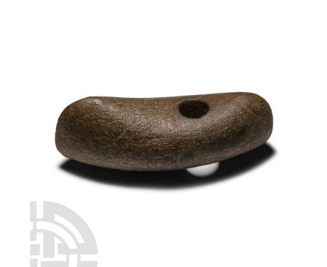 Neolithic Period, circa 6th-4th millennium B.C. With curved butt and convex sides, offset mounting hole. Cf. MacGregor, A., (