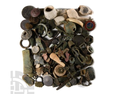 12th-19th century A.D.. Mixed group of artefacts including a spur bar, lead spindle whorls, clay pipe fragments, buckles, coi