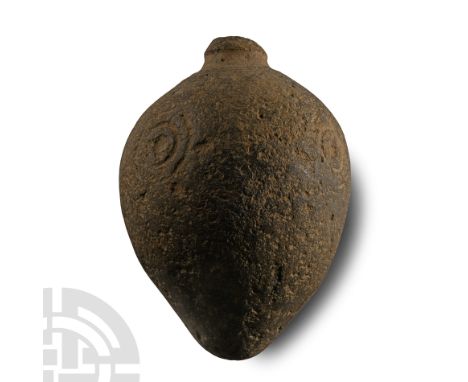 9th-11th century A.D.. Piriform body decorated from concentric circles, with domed filler-hole, intended to be filled with ex