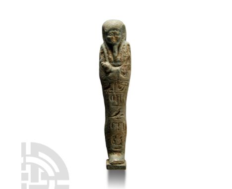 30th Dynasty, 380-343 B.C. Composed as a mummiform figure with tripartite wig and hands crossed at the chest, holding a pick,