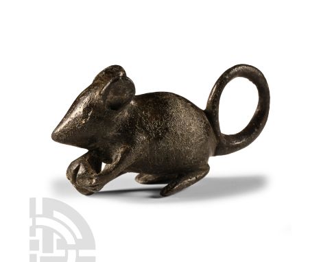 1st-2nd century A.D.. Modelled in the round, crouching, holding a nut in its raised forepaws, tail looped to the rear. Cf. Du